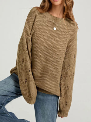 Apricot pullover sweater featuring ribbed and textured