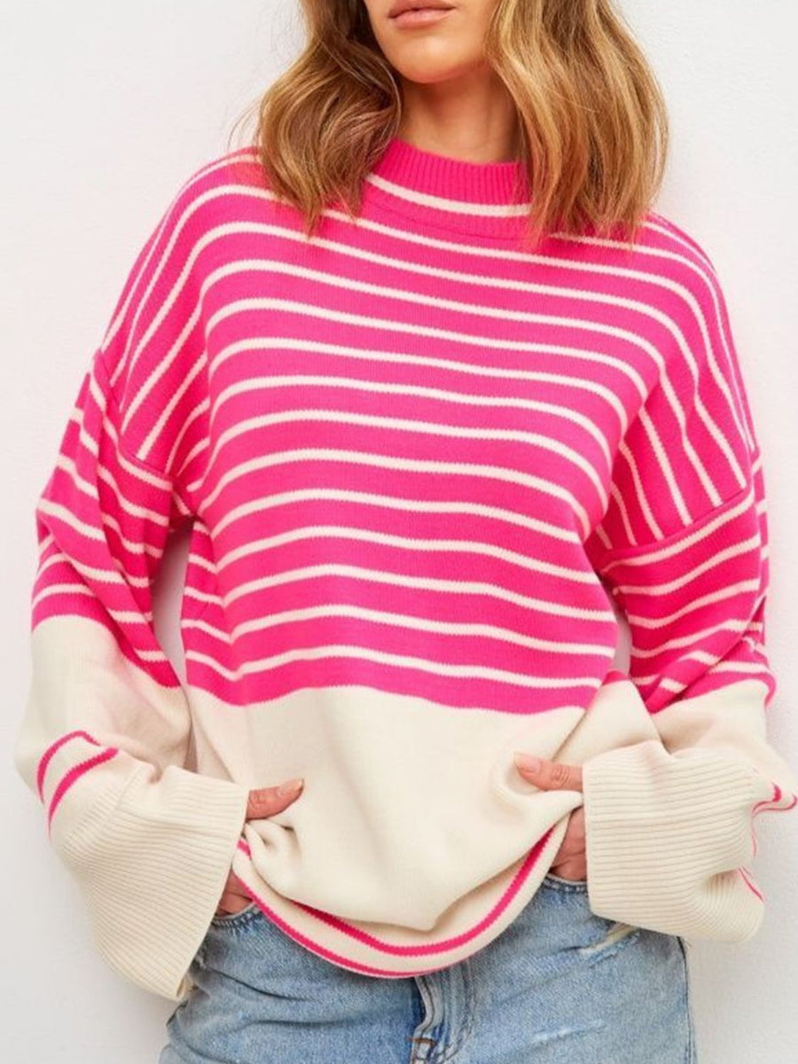 Colorblock stripe knit sweater with bell sleeves in pink and cream.