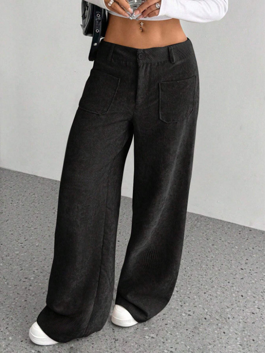 Black corduroy wide-leg utility trousers with front patch pockets.