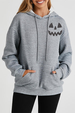 Charcoal waffle knit hoodie with jack-o-lantern graphic and front pocket.
