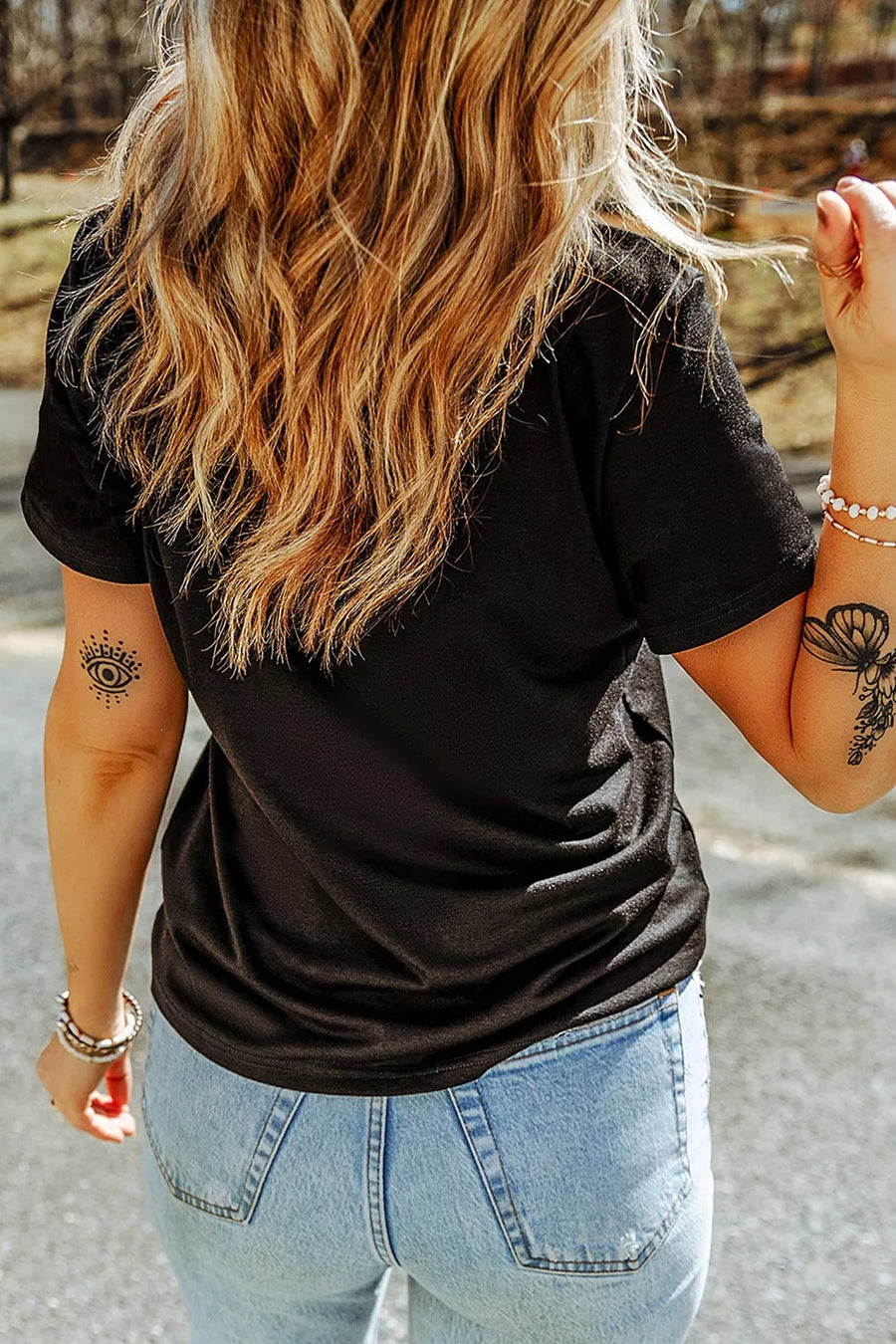 cream t-shirt featuring short sleeve and applique