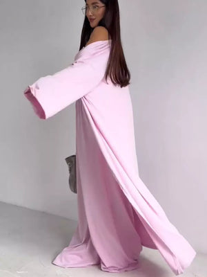 Blush pink maternity one-piece swimsuit with off-the-shoulder neckline and long sleeves.