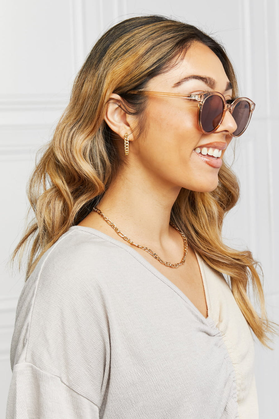 Tortoiseshell round frame sunglasses with tan translucent frames.