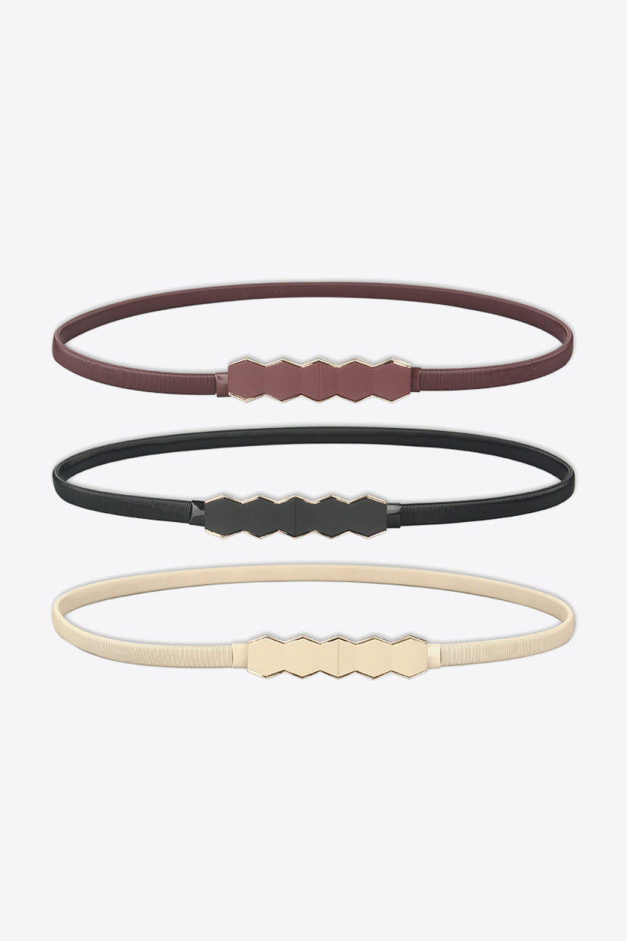 Thin elastic belts in black, cream, and wine with geometric buckle detail