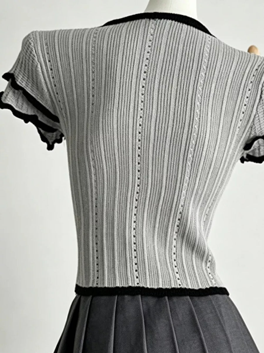Gray ribbed maternity t-shirt with black frill collar and sleeve details.