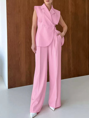 Pink two-piece set with hip-length top, full-length bottom and button, zipper