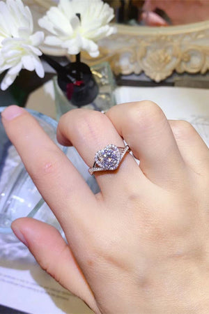 Silver heart halo moissanite engagement ring with pave band.
