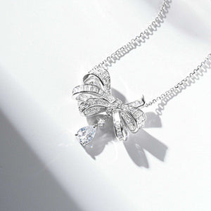 necklace in silver with bow design and princess