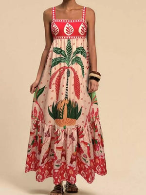 Tropical maxi dress with square neck, palm tree and bird print, tiered hem, and red yoke detail.
