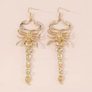 earrings in clear with animal motif and dangle