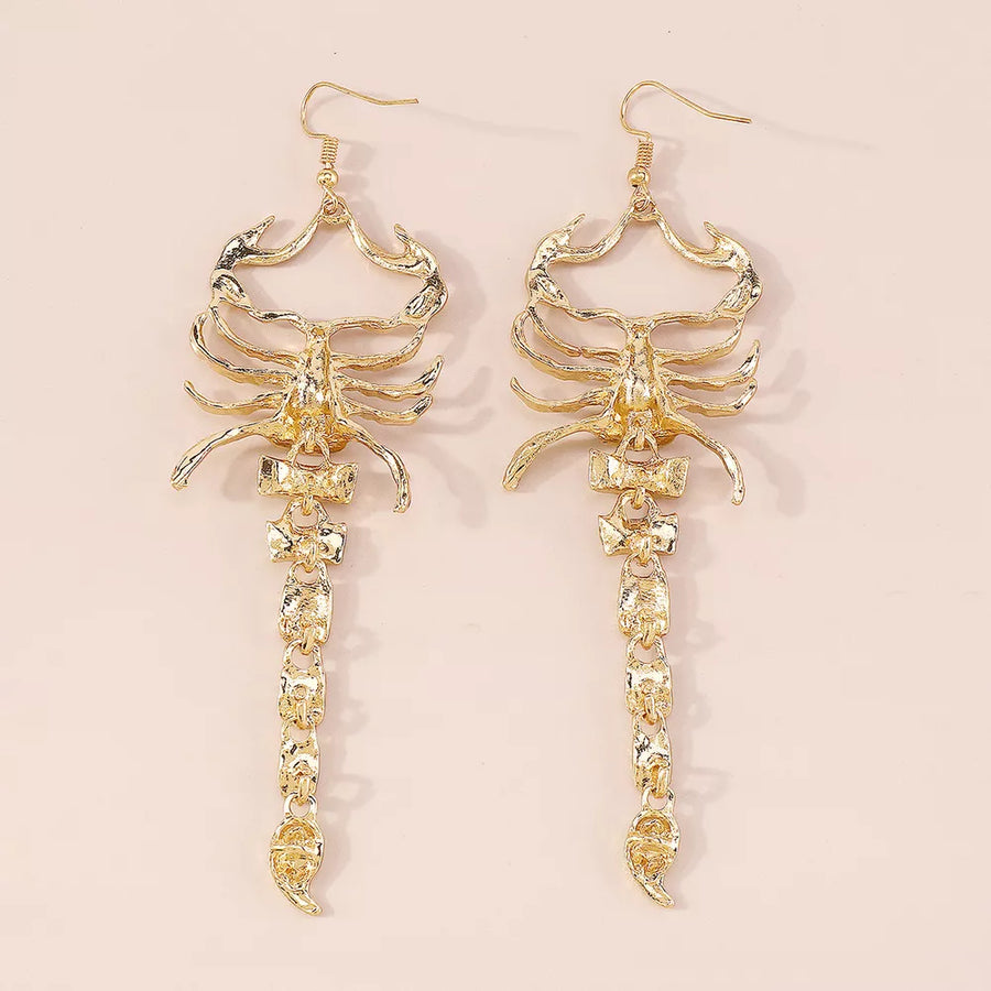 earrings in clear with animal motif and dangle