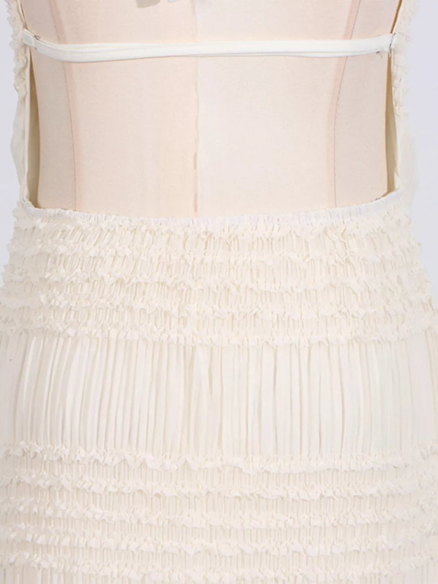 Cream textured halter neck maxi maternity swim dress with smocked waist and tiered skirt detail.