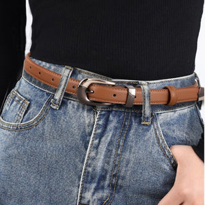 Brown cowhide leather belt with metal buckle and multiple holes.
