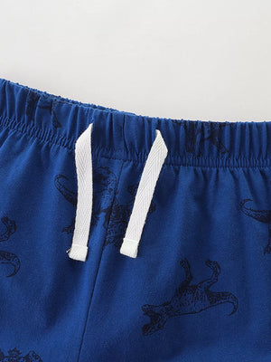 Blue cotton shorts with black dinosaur print and white drawstring waist.
