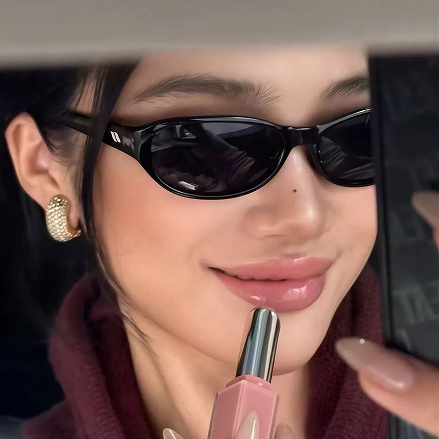 sunglasses in black featuring UV400 protection and oval fit
