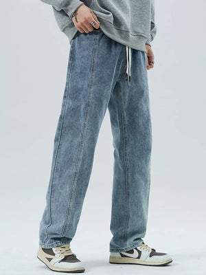 Men's light blue 100% cotton loose-fit jeans with drawstring waist and front seam detail.