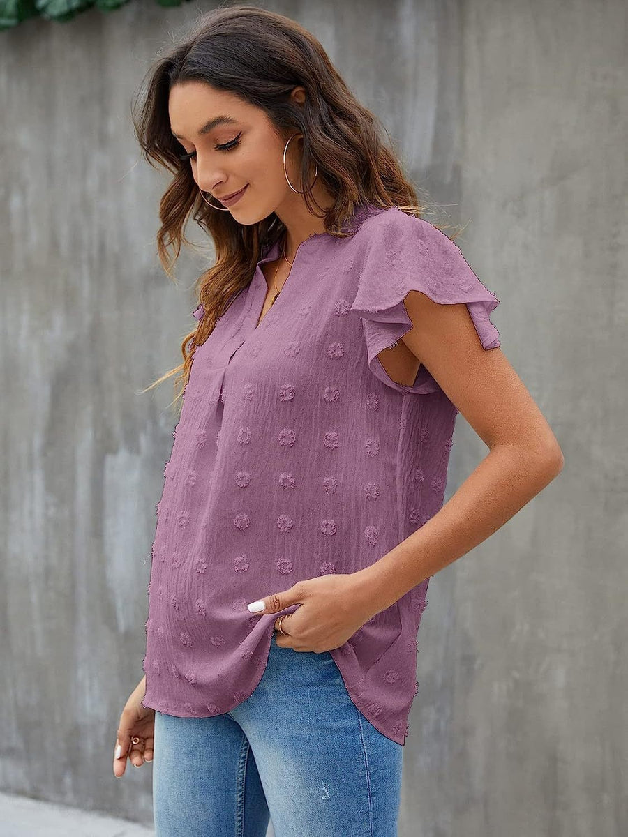 Lavender flutter sleeve Swiss dot blouse with V-neck and textured pattern.