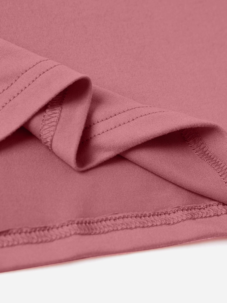 Dusty pink t-shirt with textured finish and visible stitching detail.