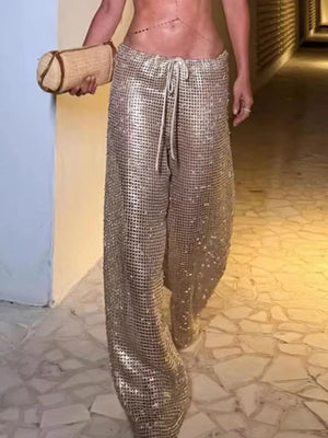 Glamorous wide-leg pants in shimmering gold with a drawstring waist.