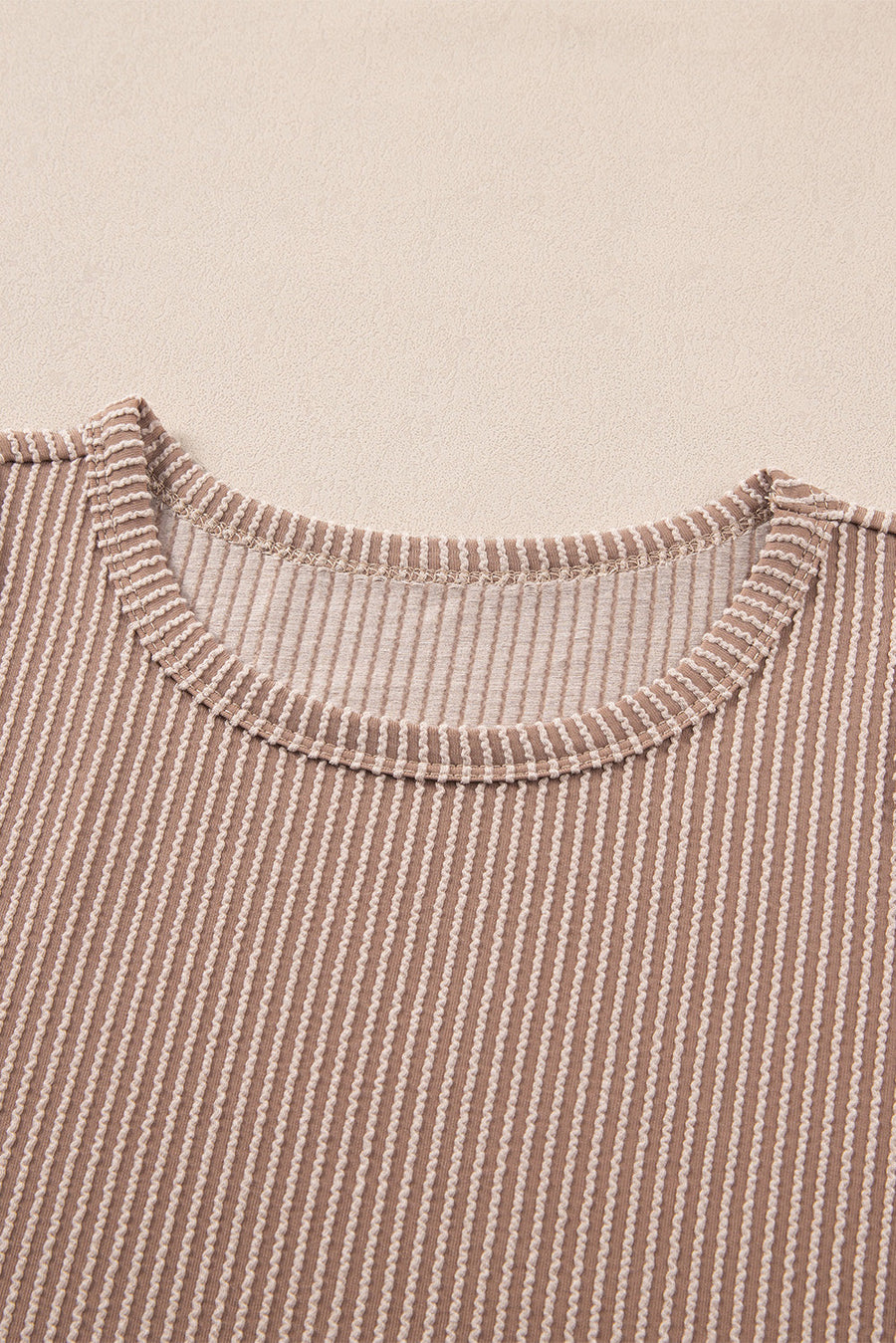 Tan textured stripe tank top with crew neck and ribbed trim.
