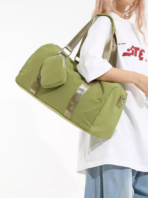 Green duffle bag with detachable pouch and gold stripe detail.