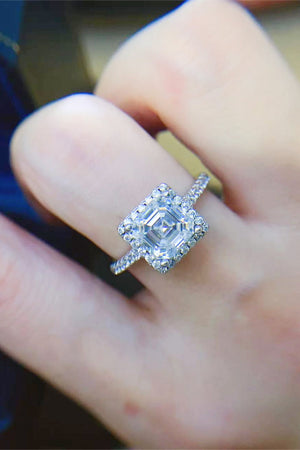 Silver Asscher cut moissanite halo ring with pave band.