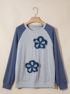 Raglan shirt with two denim flower patches on gray body and blue sleeves