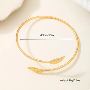 bracelet featuring leaf in gold with 18K Gold-Plated, Zinc alloy Care instructions: Avoid wearing during exercise, as texture