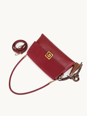 burgundy with crossbody bag with gold-tone hardware