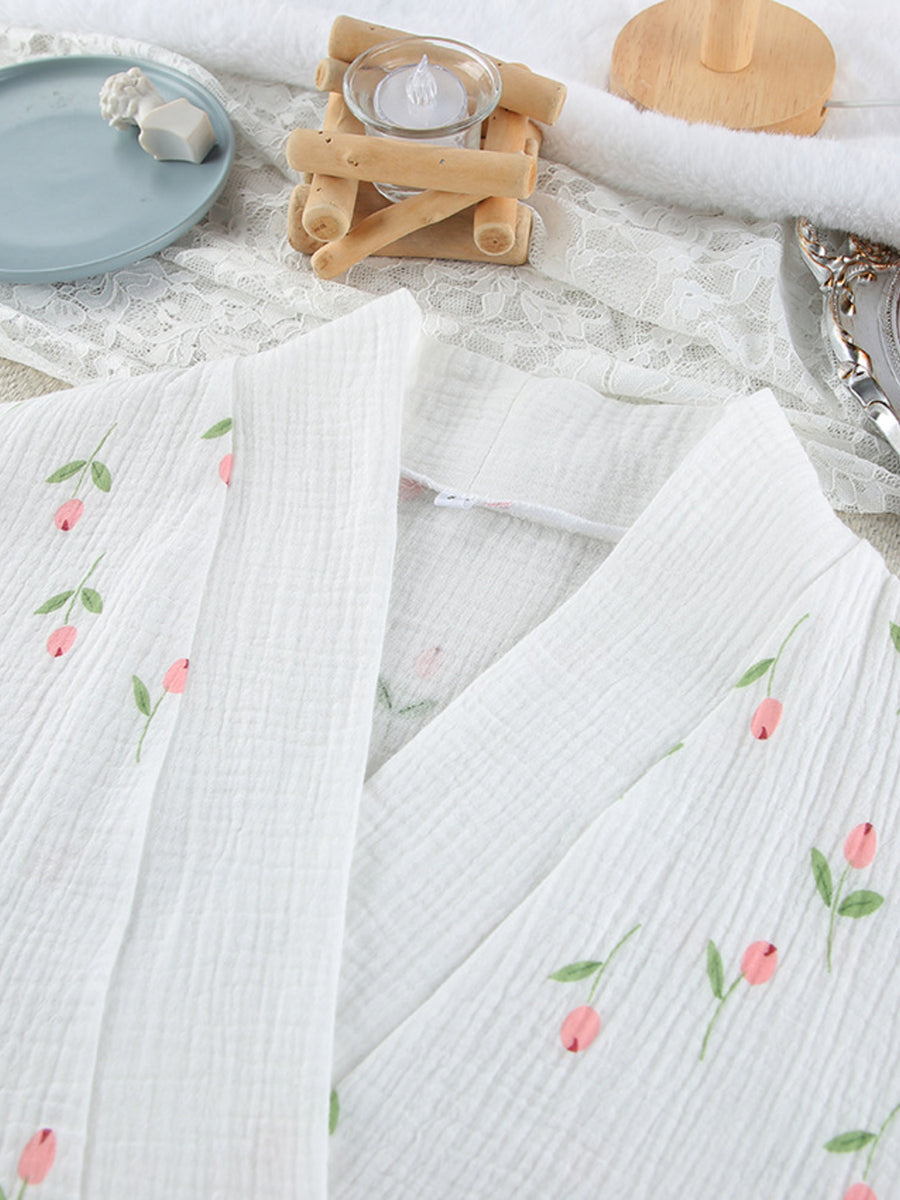 White cotton robe with delicate pink floral print and green leaves
