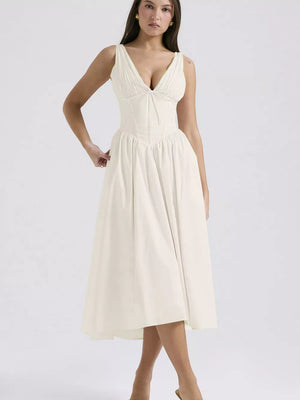 Cream v-neck midi dress with ruched bodice and full a-line skirt.