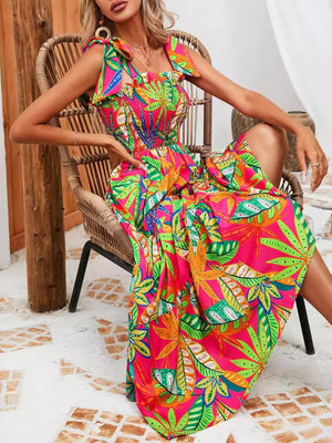 Tropical tie-strap smocked midi dress in strawberry with a vibrant leaf print.