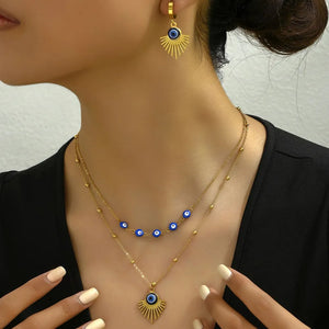 gold jewelry set with evil eye motif and not applicable