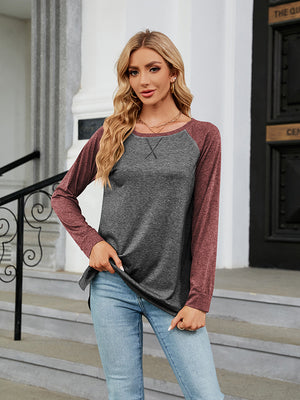 Colorblock raglan crewneck sweatshirt with charcoal body and maroon sleeves.
