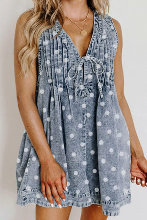 Denim polka dot romper with tie-front neckline and pleated details