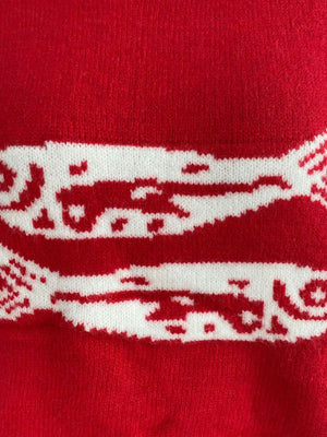 red crewneck sweater with ribbed cuffs and long sleeve