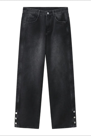 Dark wash baggy denim jeans with snap hem detail