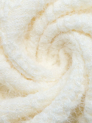 Textured cream t-shirt fabric with a soft, fuzzy finish and a swirling pattern.