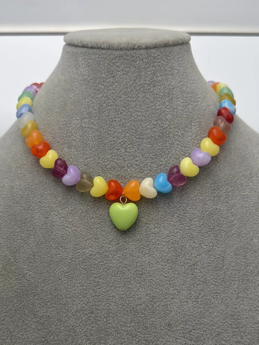 necklace featuring heart in lime green with Acrylic Care instructions: 1 texture