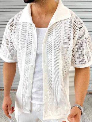 Ivory open-knit resort shirt with short sleeves and a collared neckline, styled over a tank top.