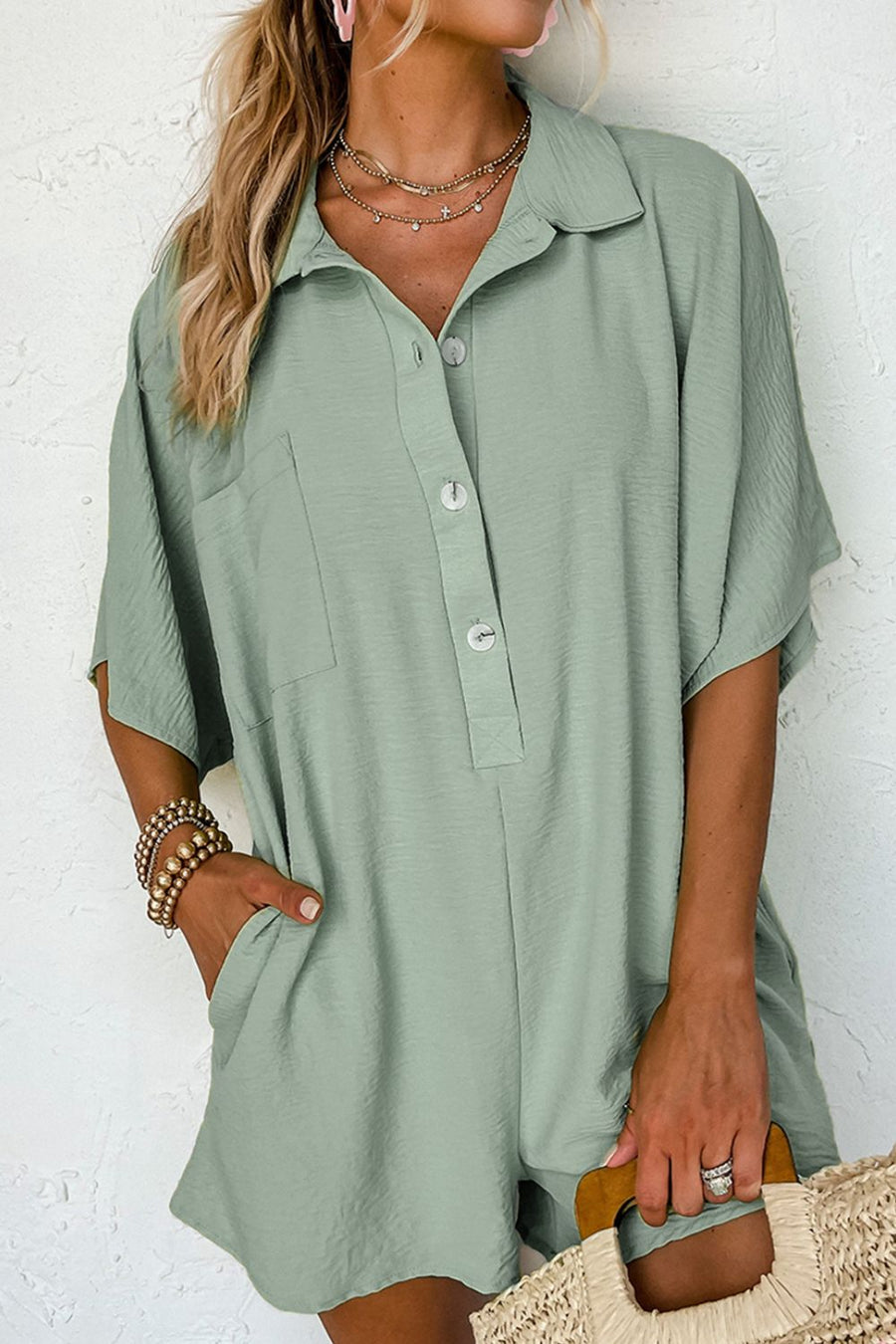 Sage oversized shirt romper with pockets and button front
