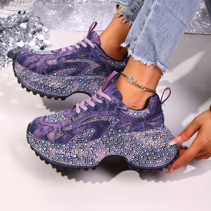 Purple rhinestone high-heel platform sneakers with chunky soles and lace-up closure.