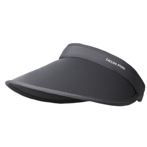 Grey nylon sun visor with curved brim and subtle logo detail.
