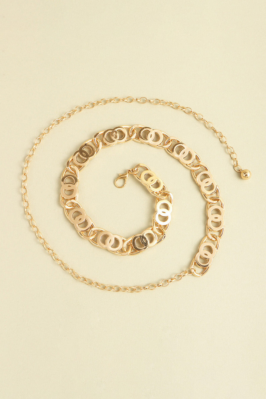 Golden circle chain belt with lobster clasp and extender chain.