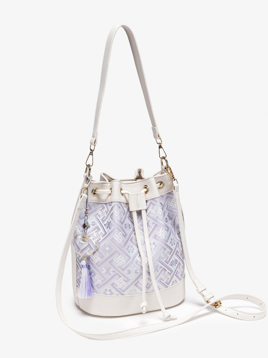 crossbody bag in White with geometric and drawstring closure
