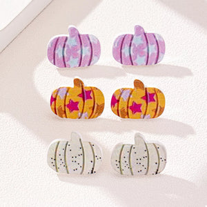 yellow earrings featuring pumpkin shape and striped