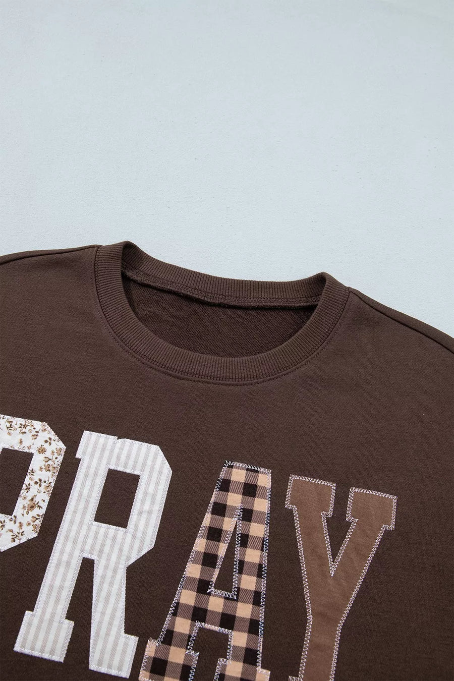 Plaid Pray Crew Neck Sweatshirt in Dark Brown with graphic print