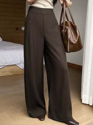 97% polyester, 3% elastane Care instructions: Machine wash cold wide-leg pants in dark brown with flared silhouette