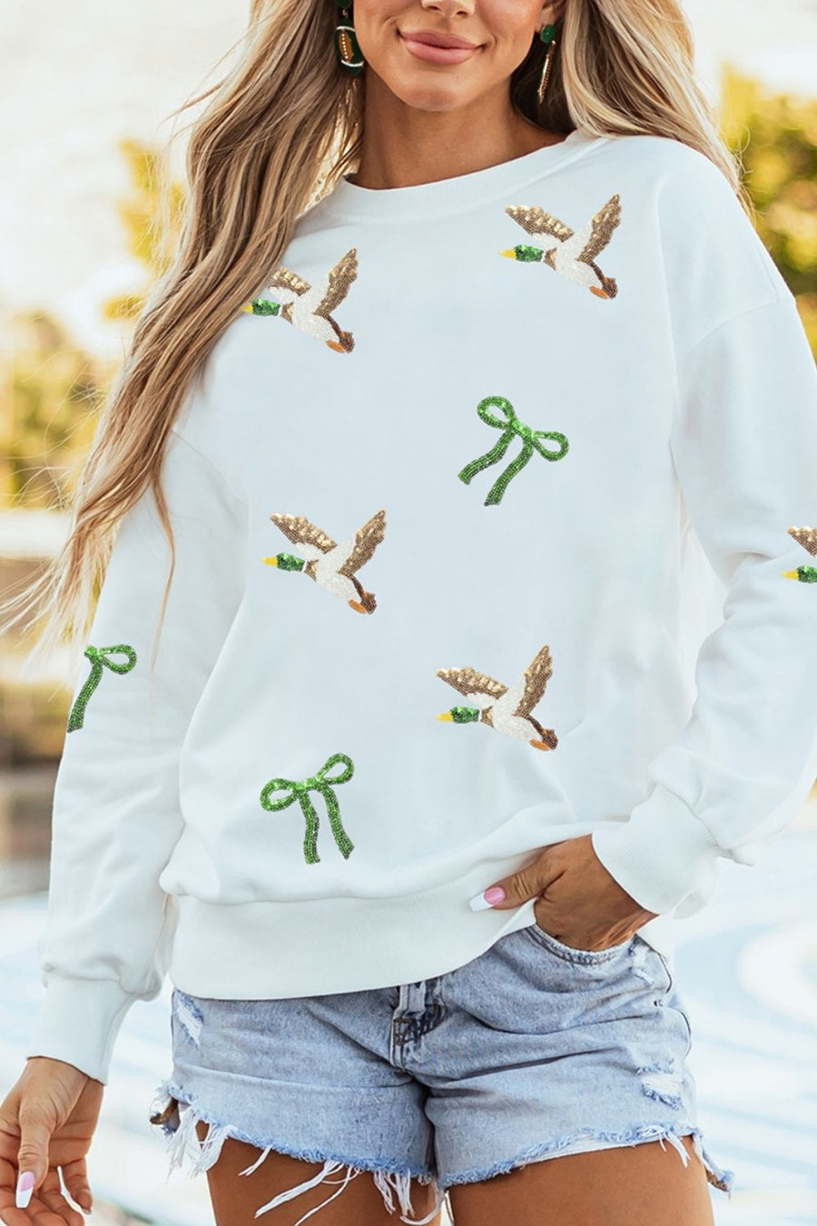 pullover sweater in White with graphic print and sequin embellishment