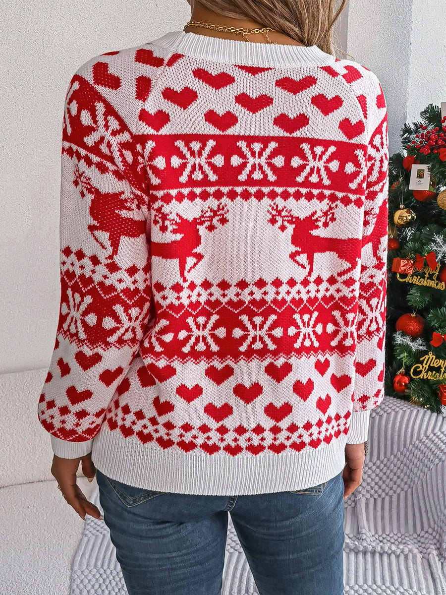 White acrylic sweater with red reindeer, snowflake, and heart jacquard pattern.